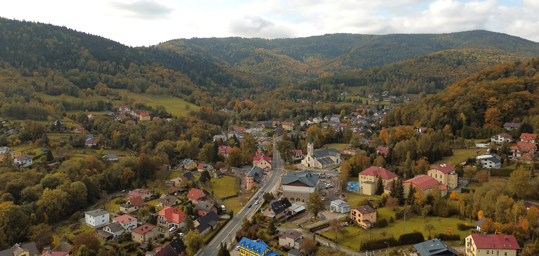 aerial-view-houses-hilly-rural-town image