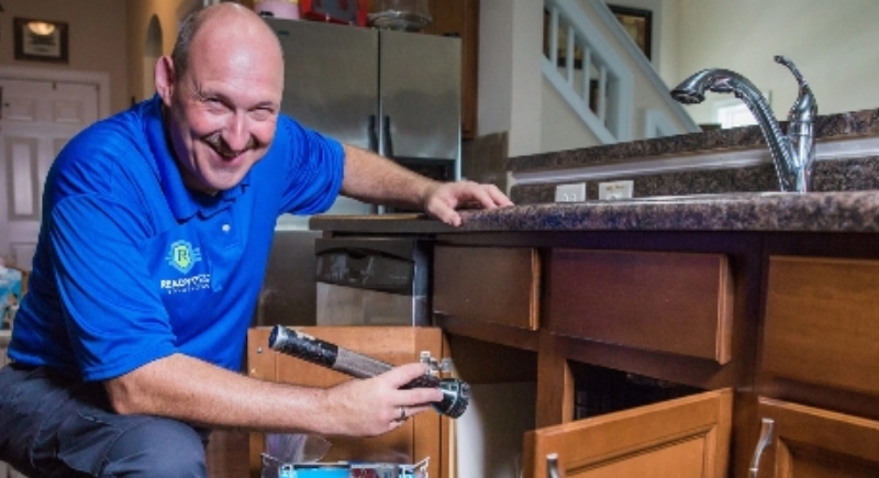 root-cause image Ready Pest Solutions technician performing a pest inspection in a home