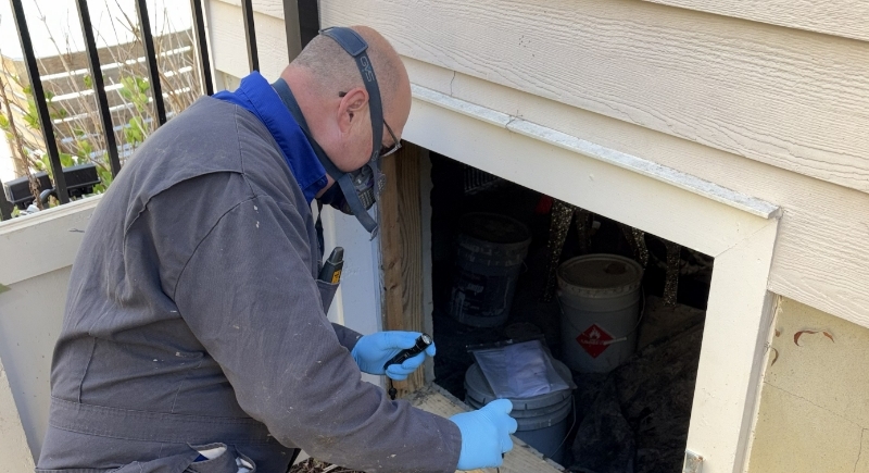 service-beyond image Ready Pest Solutions technician treating home